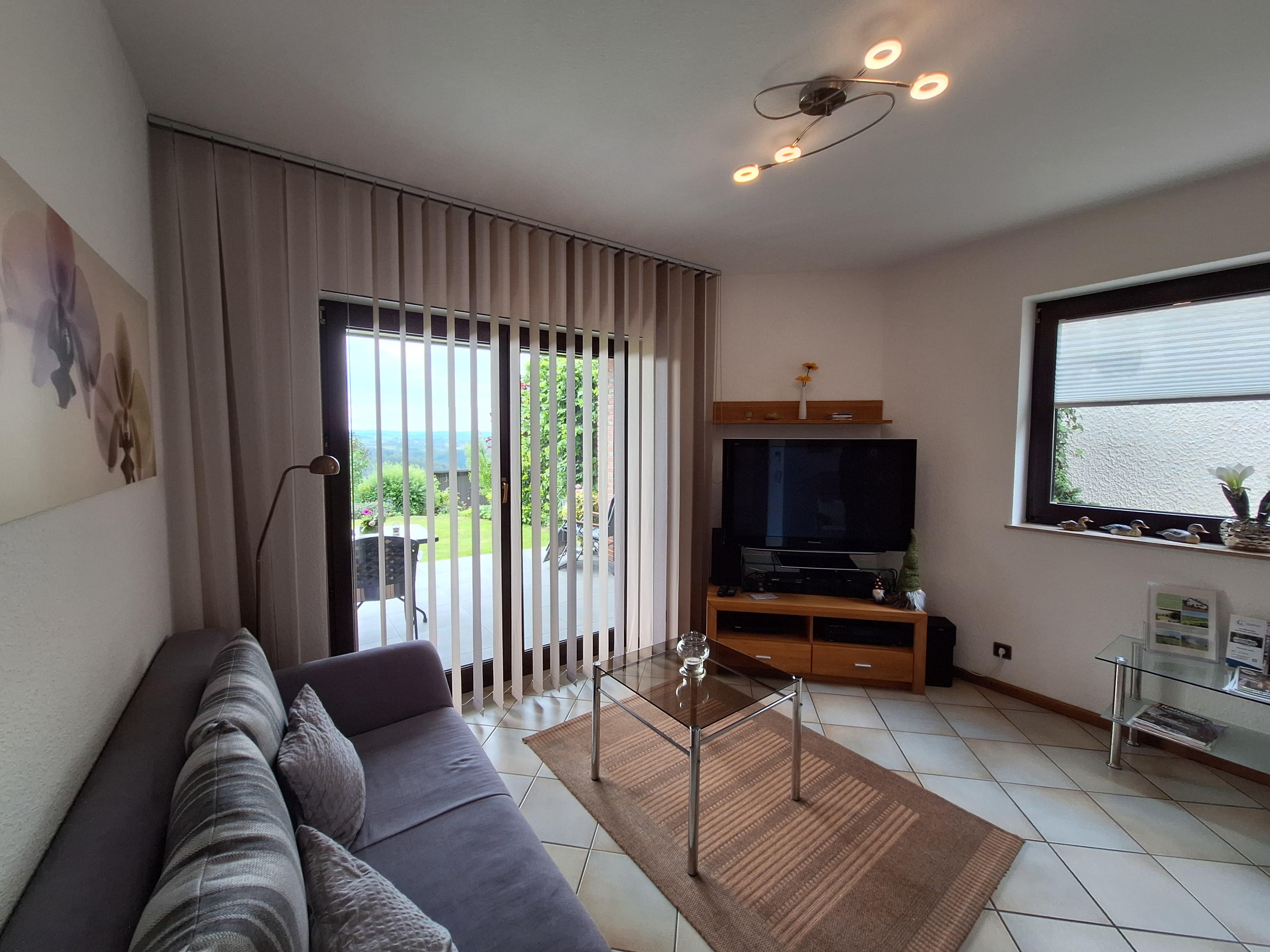 Foto: Wohnbereich mit Zugang zur Terrasse